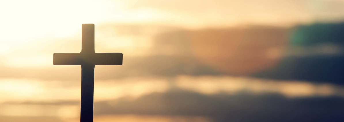 Silhouette of a Cross at Sunset